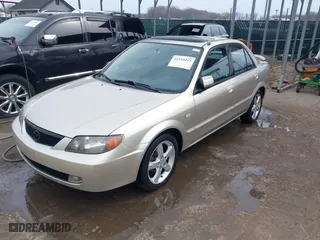 2003 Mazda Protege DX with VIN JM1BJ226031138221, listed as a IAAI auction lot 41554217 with 167,925 mi miles. Bid and sale history available at carsss.com. Image 17.