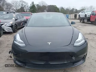 2019 Tesla Model 3 Mid Range with VIN 5YJ3E1EA5KF297213, listed as a IAAI auction lot 41361412 with 93,801 mi miles and . Bid and sale history available at carsss.com. Image 12.