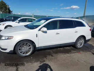 2013 Lincoln MKT EcoBoost with VIN 2LMHJ5AT8DBL55167, listed as a IAAI auction lot 41894396 with 121,114 mi miles. Bid and sale history available at carsss.com. Image 14.