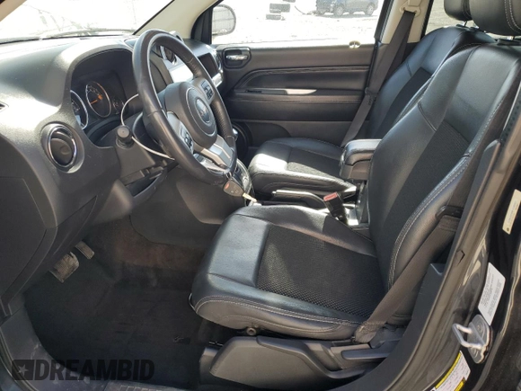2014 Jeep Compass Latitude with VIN 1C4NJDEB8ED530267, listed as a Copart auction lot 49358905 with 184,965 mi miles and Salvage Title. Bid and sale history available at DreamBid. Image 7.