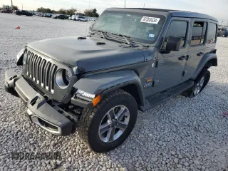 2020 Jeep Wrangler Unlimited Sahara Altitude with VIN 1C4HJXEG2LW206453, listed as a Copart auction lot 82303434 with 51,559 mi miles and Salvage title. Bid and sale history available at DreamBid. Image 1.