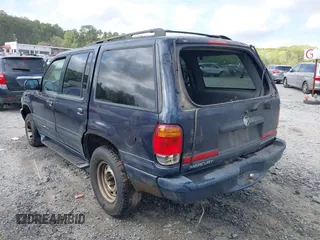 1999 Mercury Mountaineer z VIN 4M2DU52P3XUJ37055, wystawiony jako IAAI lot #41940577 z przebiegiem 218 702 mil mil oraz . Historia ofert i sprzedaży dostępna na DreamBid. Obrazek 3.