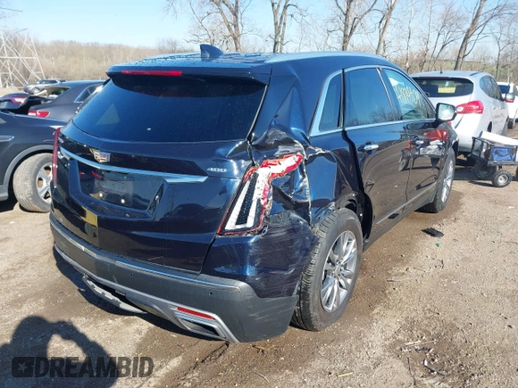 2021 Cadillac XT5 FWD Premium Luxury z VIN 1GYKNCRS2MZ141440, wystawiony jako IAAI lot #41874409 z przebiegiem 76 911 mil mil oraz . Historia ofert i sprzedaży dostępna na DreamBid. Obrazek 6.