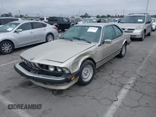 1985 BMW 6 Series 635CSi with VIN WBAEC8400F0610637, listed as a IAAI auction lot 41935412 with 129,943 mi miles. Bid and sale history available at carsss.com. Image 2.