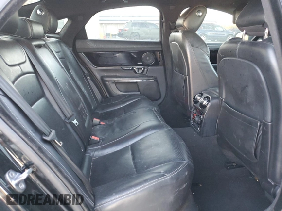 2015 Jaguar XJ z VIN SAJWA1CZ5F8V90554, wystawiony jako Copart lot #83623994 z przebiegiem 104 440 mil mil oraz Szkoda całkowita • Salvage title. Historia ofert i sprzedaży dostępna na DreamBid. Obrazek 11.
