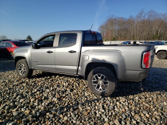 2021 GMC Canyon 4WD AT4 w/Cloth with VIN 1GTG6FEN0M1236099, listed as a Copart auction lot 80911974 with 122,672 mi miles and Salvage Title. Bid and sale history available at carsss.com. Image 2.