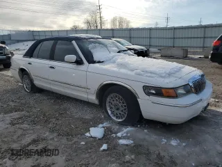 2001 Mercury Grand Marquis GS z VIN 2MEFM74W61X695639, wystawiony jako Copart lot #42099295 z przebiegiem 137 501 mil mil oraz Nie do naprawy • Non repairable. Historia ofert i sprzedaży dostępna na DreamBid. Obrazek 4.