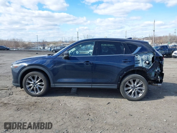 2020 Mazda CX-5 Grand Touring with VIN JM3KFBDM2L0768770, listed as a IAAI auction lot 41695058 with 44,192 mi miles. Bid and sale history available at carsss.com. Image 13.