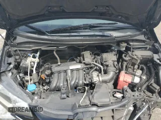 2015 Honda Fit EX-L z VIN 3HGGK5H81FM765225, wystawiony jako Copart lot #56765815 z przebiegiem 126 730 mil mil oraz Szkoda całkowita • Salvage title. Historia ofert i sprzedaży dostępna na DreamBid. Obrazek 11.