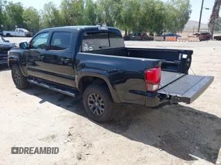 2023 Toyota Tacoma SR with VIN 3TMCZ5AN1PM654572, listed as a IAAI auction lot 42312575 with 14,111 mi miles and . Bid and sale history available at DreamBid. Image 3.