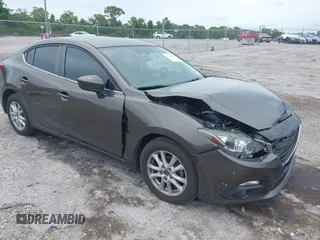 2016 Mazda 3 i Grand Touring z VIN 3MZBM1X77GM256145, wystawiony jako IAAI lot #42433438 z przebiegiem 250 285 mil mil oraz . Historia ofert i sprzedaży dostępna na DreamBid. Obrazek 1.