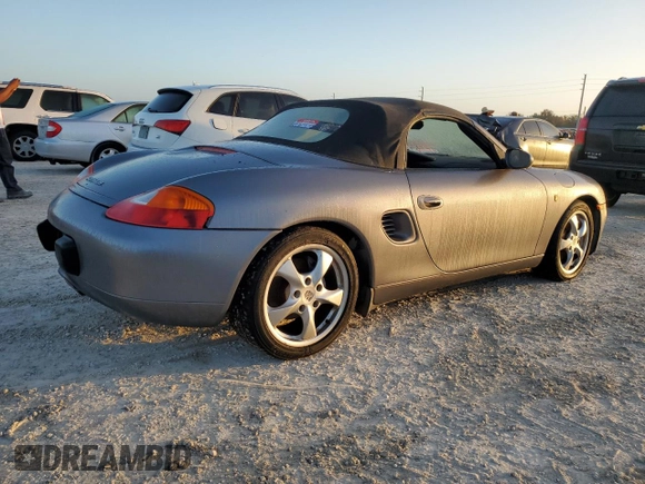 2001 Porsche Boxster с VIN WP0CA29871U627108, выставлен на аукционе Copart как лот 43968805 с пробегом Не указан миль и Списание • Salvage title. История ставок и продаж доступна на DreamBid. Изображение 3.