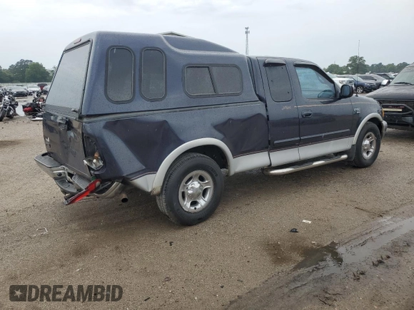 2000 Ford F-150 XL with VIN 1FTRX17L7YNC24292, listed as a Copart auction lot 58852925 with 213,318 mi miles and Salvage title. Bid and sale history available at DreamBid. Image 3.