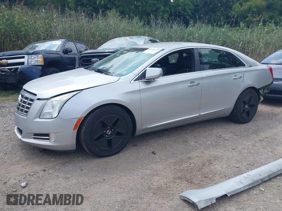 2014 Cadillac XTS Luxury z VIN 2G61N5S38E9270619, wystawiony jako IAAI lot #40140617 z przebiegiem 117 286 mil mil oraz . Historia ofert i sprzedaży dostępna na DreamBid. Obrazek 2.