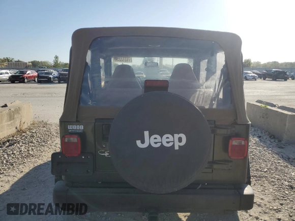 1998 Jeep Wrangler Sport with VIN 1J4FY19S0WP709843, listed as a Copart auction lot 74312254 with 147,010 mi miles and Salvage Title. Bid and sale history available at carsss.com. Image 6.