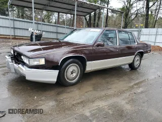 1990 Cadillac DeVille z VIN 1G6CD5333L4296359, wystawiony jako Copart lot #82785934 z przebiegiem 76 887 mil mil oraz Nie do naprawy • Non repairable. Historia ofert i sprzedaży dostępna na DreamBid. Obrazek 1.