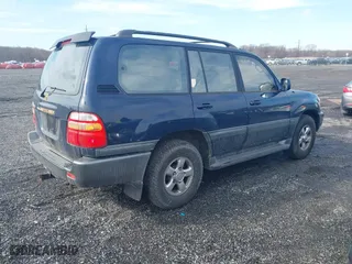 2002 Toyota Land Cruiser with VIN JTEHT05J122018974, listed as a IAAI auction lot 41543290 with 266,926 mi miles. Bid and sale history available at carsss.com. Image 4.