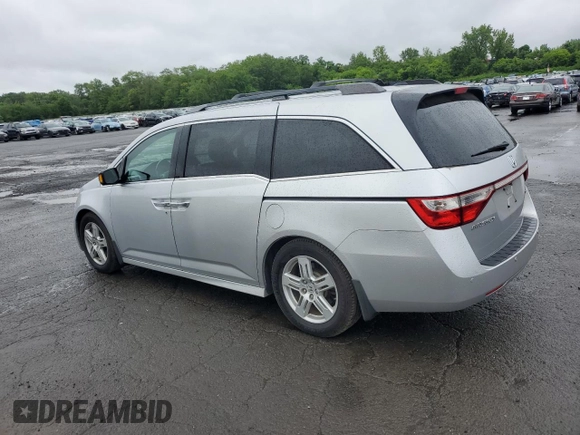 2011 Honda Odyssey Touring with VIN 5FNRL5H99BB021223, listed as a Copart auction lot 61171775 with 194,029 mi miles and Salvage title. Bid and sale history available at DreamBid. Image 2.