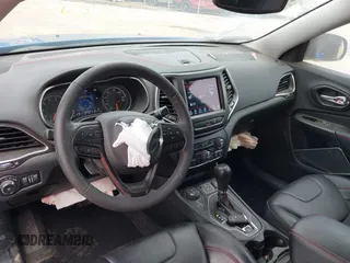 2022 Jeep Cherokee Trailhawk z VIN 1C4PJMBX4ND513488, wystawiony jako IAAI lot #42137114 z przebiegiem 12 306 mil mil oraz . Historia ofert i sprzedaży dostępna na DreamBid. Obrazek 18.