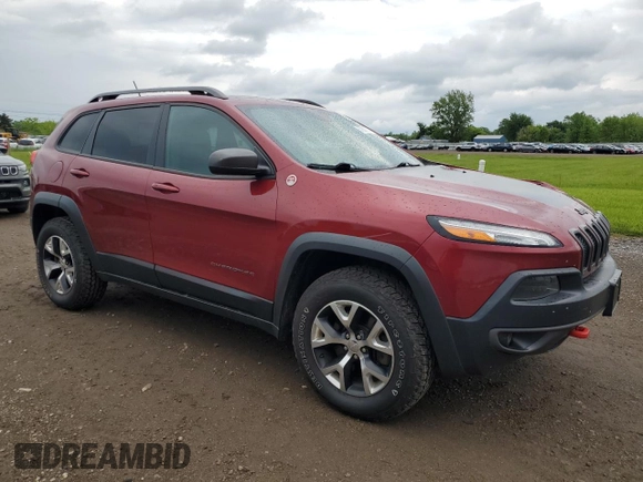 2014 Jeep Cherokee Trailhawk z VIN 1C4PJMBS2EW130125, wystawiony jako Copart lot #57830635 z przebiegiem 117 811 mil mil oraz Szkody całkowita. Historia ofert i sprzedaży dostępna na DreamBid. Obrazek 4.