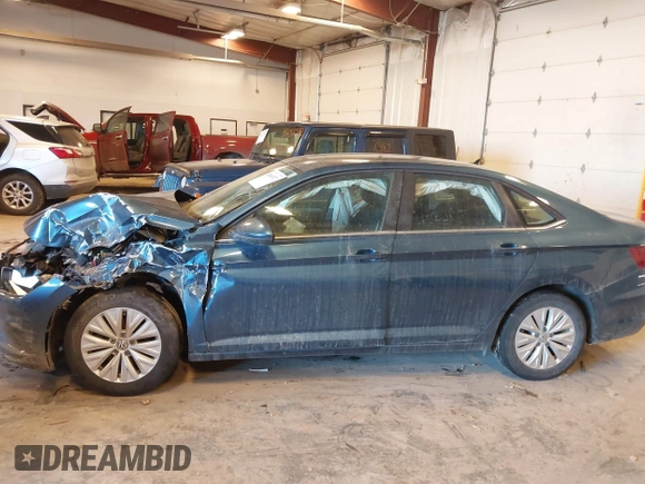 2019 Volkswagen Jetta S z VIN 3VWCB7BU9KM194136, wystawiony jako IAAI lot #41463927 z przebiegiem 103 847 mil mil oraz . Historia ofert i sprzedaży dostępna na DreamBid. Obrazek 14.