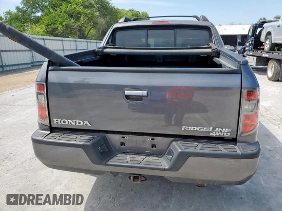 2014 Honda Ridgeline RTL z VIN 5FPYK1F53EB004694, wystawiony jako Copart lot #57222085 z przebiegiem 128 210 mil mil oraz Szkoda całkowita • Salvage title. Historia ofert i sprzedaży dostępna na DreamBid. Obrazek 6.
