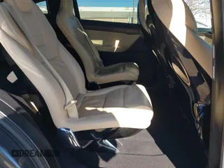 2016 Tesla Model X 70D with VIN 5YJXCBE24GF019450, listed as a IAAI auction lot 41517321 with 96,831 mi miles. Bid and sale history available at carsss.com. Image 8.