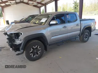 2018 Toyota Tacoma SR with VIN 3TMCZ5ANXJM146284, listed as a IAAI auction lot 42041525 with 103,143 mi miles and . Bid and sale history available at DreamBid. Image 2.