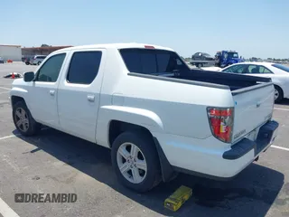 2013 Honda Ridgeline RTL with VIN 5FPYK1F50DB013612, listed as a IAAI auction lot 42430119 with 190,913 mi miles and . Bid and sale history available at DreamBid. Image 3.