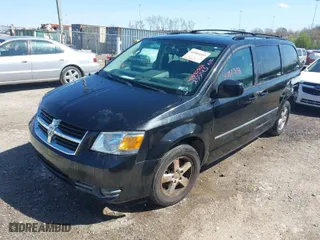 2010 Dodge Grand Caravan SXT with VIN 2D4RN5D18AR233143, listed as a IAAI auction lot 41880502 with 145,356 mi miles. Bid and sale history available at carsss.com. Image 2.