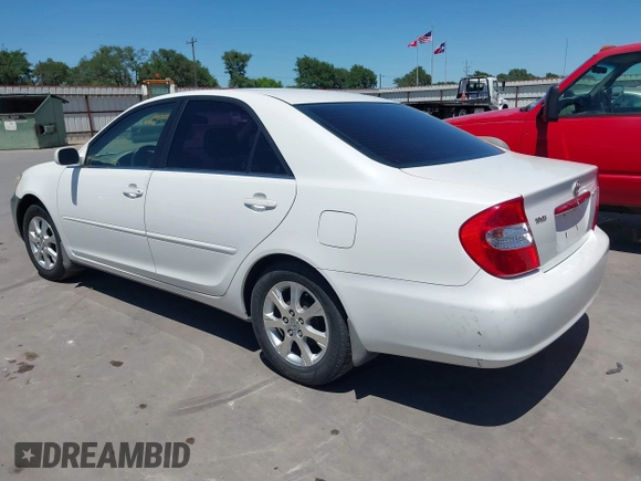 2004 Toyota Camry LE with VIN JTDBE32K840277463, listed as a IAAI auction lot 42080523 with 139,558 mi miles. Bid and sale history available at carsss.com. Image 3.