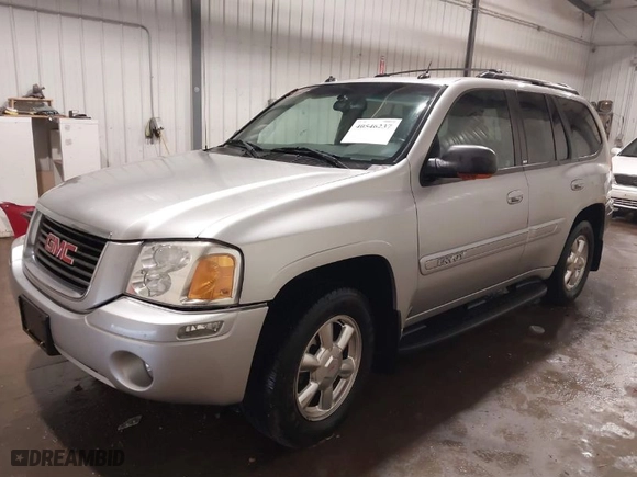 2004 GMC Envoy SLE with VIN 1GKDT13S042139622, listed as a IAAI auction lot 40546237 with 168,715 mi miles. Bid and sale history available at carsss.com. Image 2.