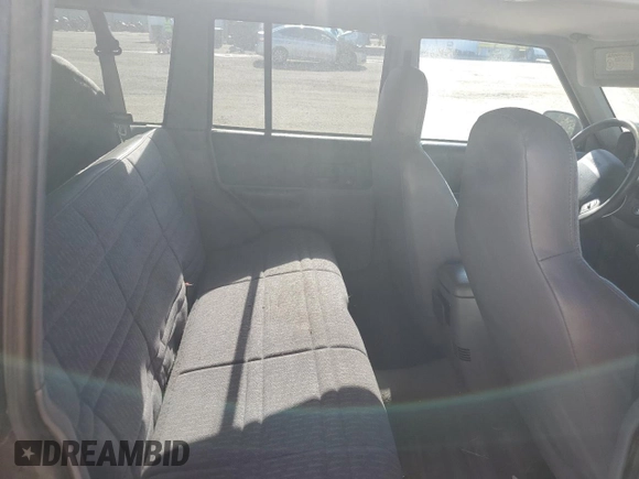 1998 Jeep Cherokee Sport with VIN 1J4FT68S5WL136989, listed as a Copart auction lot 81035084 with 140,848 mi miles and Salvage Title. Bid and sale history available at carsss.com. Image 11.