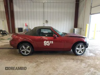 2007 Mazda MX-5 Miata Sport z VIN JM1NC25F970132299, wystawiony jako IAAI lot #41622791 z przebiegiem 72 392 mil mil oraz . Historia ofert i sprzedaży dostępna na DreamBid. Obrazek 14.