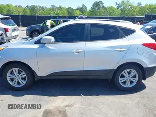 2013 Hyundai Tucson GLS with VIN KM8JU3AC3DU551018, listed as a IAAI auction lot 41988305 with 214,728 mi miles. Bid and sale history available at carsss.com. Image 14.