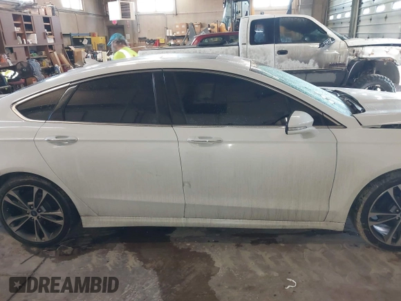 2019 Ford Fusion Titanium with VIN 3FA6P0D92KR153096, listed as a IAAI auction lot 41679393 with 127,292 mi miles and . Bid and sale history available at DreamBid. Image 14.