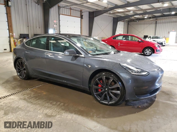 2020 Tesla Model 3 Performance z VIN 5YJ3E1EC8LF640891, wystawiony jako Copart lot #52377615 z przebiegiem 77 343 mil mil oraz Szkoda całkowita • Salvage title. Historia ofert i sprzedaży dostępna na DreamBid. Obrazek 4.
