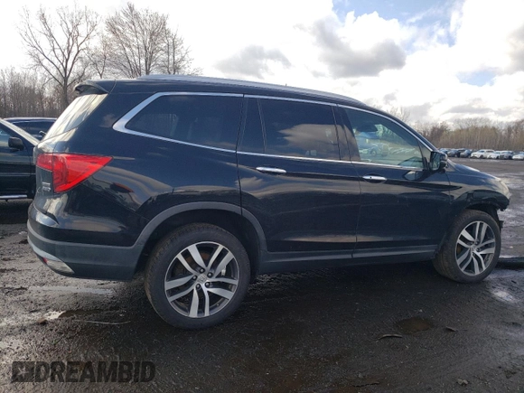 2017 Honda Pilot Touring with VIN 5FNYF6H90HB028112, listed as a Copart auction lot 52197645 with 218,944 mi miles and Salvage Title. Bid and sale history available at DreamBid. Image 3.