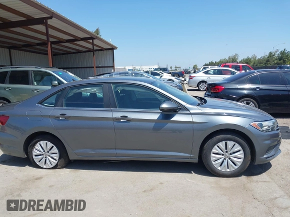 2019 Volkswagen Jetta S z VIN 3VWC57BUXKM074708, wystawiony jako IAAI lot #42151448 z przebiegiem 189 430 mil mil oraz . Historia ofert i sprzedaży dostępna na DreamBid. Obrazek 13.