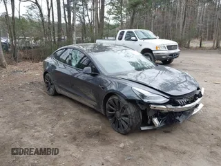 2021 Tesla Model 3 Performance with VIN 5YJ3E1EC1MF925515, listed as a IAAI auction lot 41721548 with 36,478 mi miles and . Bid and sale history available at carsss.com. Image 1.