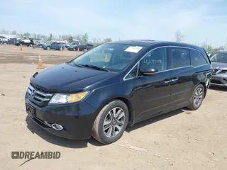 2014 Honda Odyssey Touring with VIN 5FNRL5H94EB079518, listed as a IAAI auction lot 42095098 with 141,019 mi miles and . Bid and sale history available at DreamBid. Image 2.