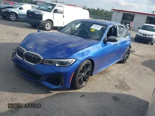2020 BMW 3 Series M340i xDrive with VIN WBA5U9C00LA379345, listed as a IAAI auction lot 41256225 with 57,856 mi miles and . Bid and sale history available at DreamBid. Image 2.