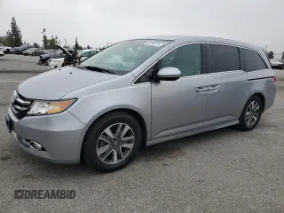 2017 Honda Odyssey Touring with VIN 5FNRL5H90HB005937, listed as a Copart auction lot 58766715 with 87,636 mi miles and Salvage title. Bid and sale history available at DreamBid. Image 1.
