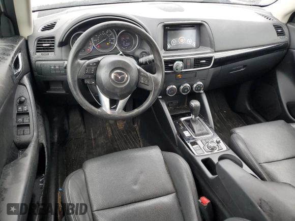 2016 Mazda CX-5 Sport z VIN JM3KE4BY2G0802376, wystawiony jako Copart lot #55976585 z przebiegiem 112 600 mil mil oraz Szkoda całkowita • Salvage title. Historia ofert i sprzedaży dostępna na DreamBid. Obrazek 8.