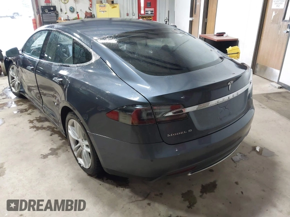 2014 Tesla Model S 60 with VIN 5YJSA1H16EFP52853, listed as a IAAI auction lot 41941989 with 132,038 mi miles and . Bid and sale history available at DreamBid. Image 3.
