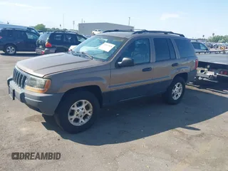 2001 Jeep Grand Cherokee Laredo with VIN 1J4GW48S81C694537, listed as a IAAI auction lot 42447828 with 162,981 mi miles and . Bid and sale history available at DreamBid. Image 2.