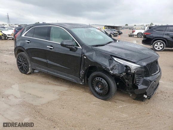 2023 Cadillac XT4 FWD Luxury with VIN 1GYAZAR45PF218684, listed as a Copart auction lot 54427565 with 74,920 mi miles and Salvage Title. Bid and sale history available at carsss.com. Image 4.