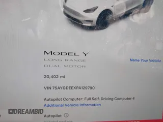 2023 Tesla Model Y Long Range with VIN 7SAYGDEEXPA129790, listed as a IAAI auction lot 41735721 with 20,402 mi miles and . Bid and sale history available at DreamBid. Image 7.