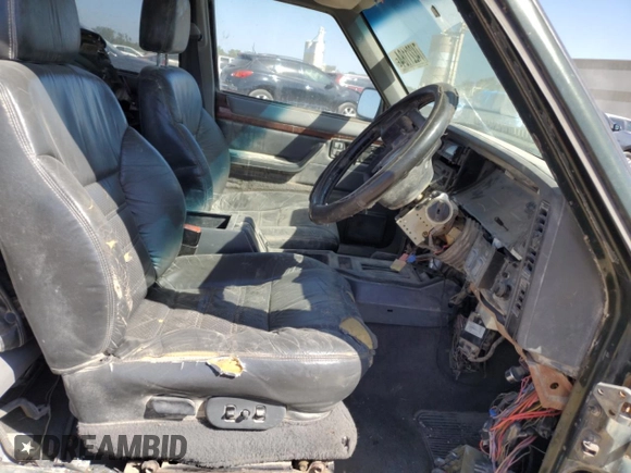 1995 Jeep Cherokee with VIN 1J4FN78S5SL557086, listed as a Copart auction lot 74221184 with 416,415 mi miles and Salvage title. Bid and sale history available at DreamBid. Image 7.
