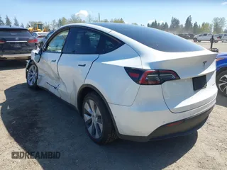 2022 Tesla Model Y Long Range z VIN 7SAYGDEE7NF418223, wystawiony jako IAAI lot #42046651 z przebiegiem 18 724 mil mil oraz . Historia ofert i sprzedaży dostępna na DreamBid. Obrazek 3.